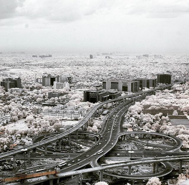 transportation, high angle view, architecture, built structure, city, building exterior, cityscape, sky, land vehicle, car, mode of transport, aerial view, road, cloud - sky, street, outdoors, day, city life, no people, travel