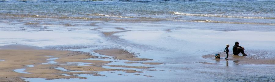 People walking on beach