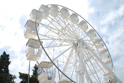 Ferris wheel, great tourist attraction in crikvenica in the summer time bellow the cloudy sky.