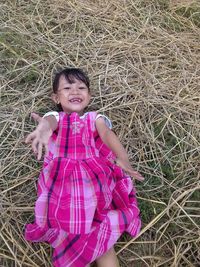 Portrait of a smiling girl on field