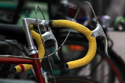 Close-up of yellow bicycle wheel