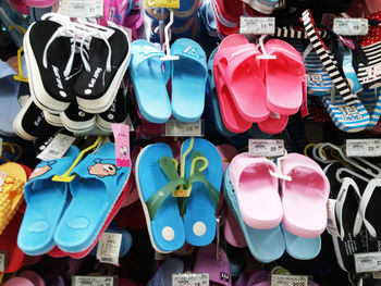 Multi colored objects for sale at market stall