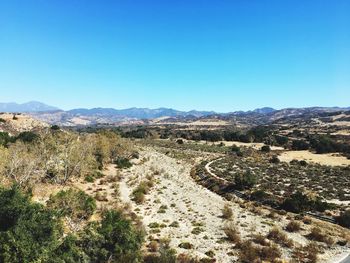 Scenic view of landscape against clear blue sky