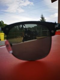 Close-up of car against sky