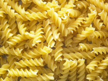 Close-up of fusilli pasta on table
