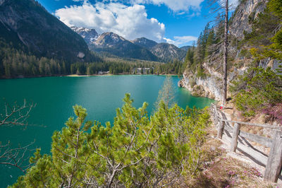 Scenic view of lake and mountains against sky