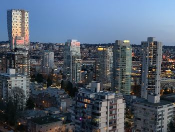 Modern buildings in city against sky