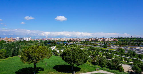 High angle view of trees and buildings against sky