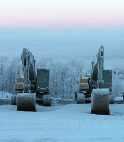 View of snow covered field against sky