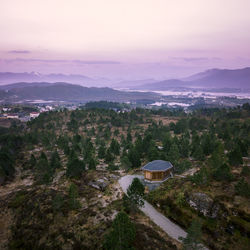 High angle view of trees and buildings against sky
