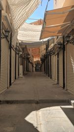 Empty alley amidst buildings