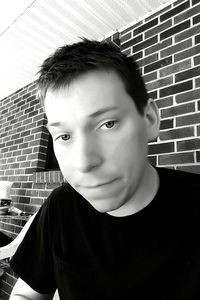 Portrait of young man standing outdoors