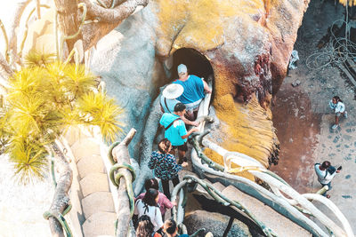 High angle view of people on rock