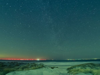 Scenic view of sea against sky at night