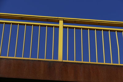 Low angle view of built structure against clear blue sky