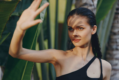 Portrait of young woman standing in gym