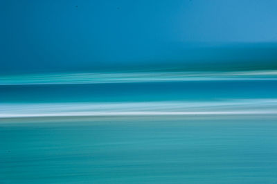 Scenic view of sea against blue sky