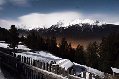 Scenic view of snow covered mountains against sky