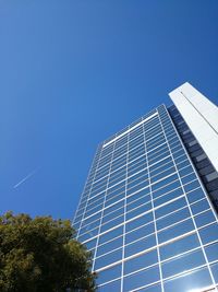 Low angle view of cables against blue sky