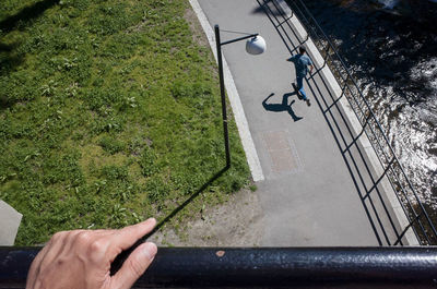 Cropped image of person standing on tiled floor