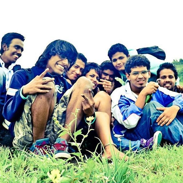 togetherness, lifestyles, bonding, leisure activity, person, happiness, grass, friendship, smiling, love, casual clothing, young men, fun, young adult, enjoyment, family, boys, field