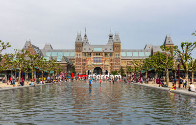 Group of people in front of buildings