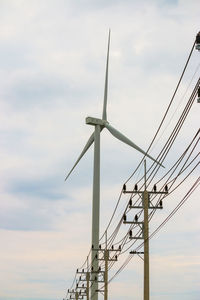 Low angle view of wind turbine against sky