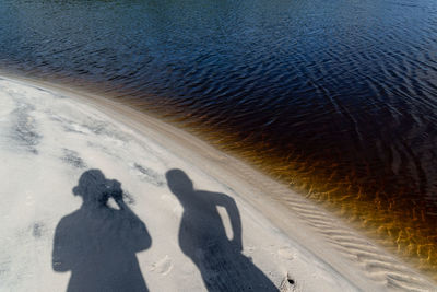 Shadow of people at beach