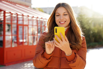 Young woman using mobile phone