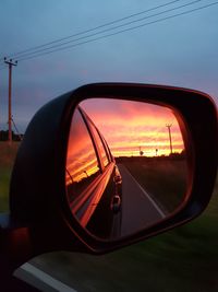 Reflection of car on side-view mirror