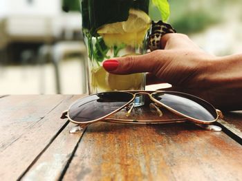 Close-up of hand holding drink