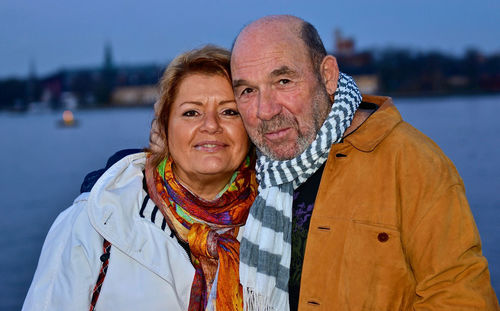 Portrait of mature couple by lake