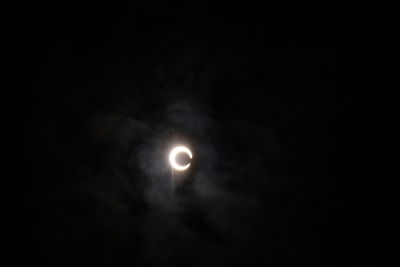 Low angle view of moon against sky at night