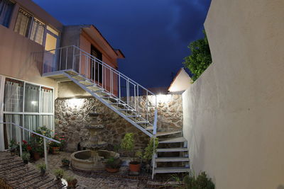 Staircase by building against sky