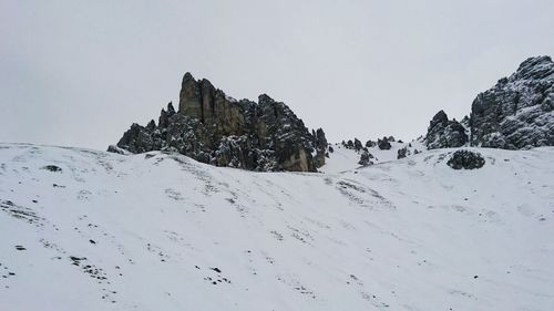 Panoramic view of mountains against sky during winter