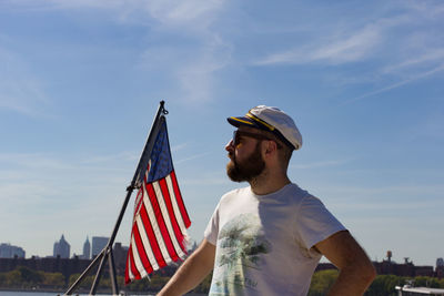 Man standing by american flag