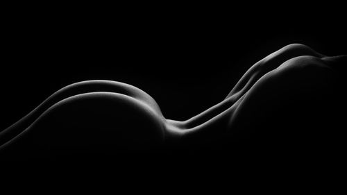 Close-up of hands over black background