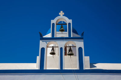 Low angle view of building against blue sky