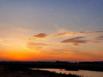 Scenic view of silhouette landscape against sky during sunset