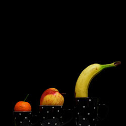 Close-up of apple against black background