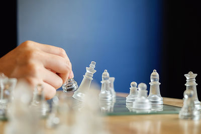 Close-up of person playing chess 