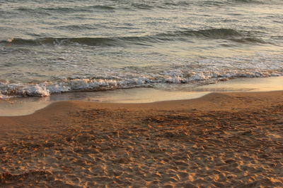 High angle view of waves rushing towards shore