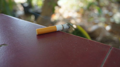 Close-up of cigarette on table