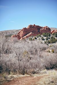 Scenic view of rocky mountains against clear blue sky