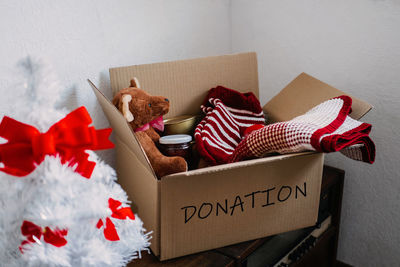 Christmas donation hampers, help refugees and homeless. xmas charity donation box with warm clothes