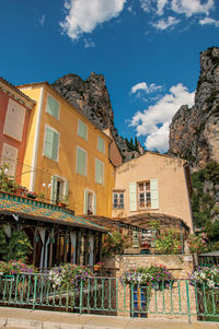 Restaurant with flowers and cliffs at moustiers-sainte-marie, in the french provence.