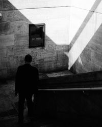 Rear view of man on staircase