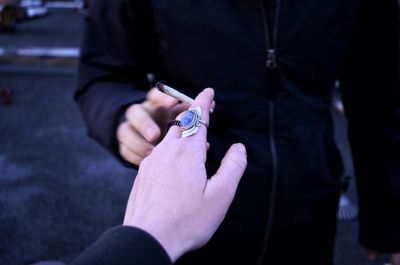 Close-up of hands holding camera