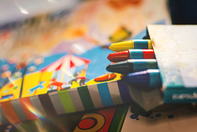 Close-up of multi colored pencils on table