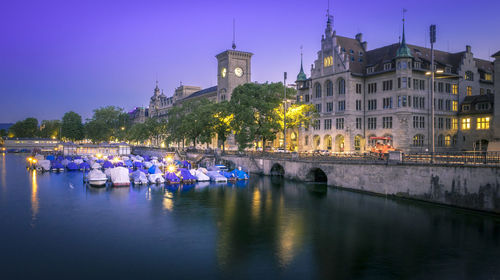 View of boats in water at night